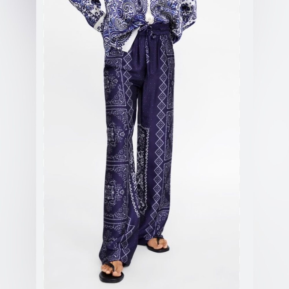 Blue Flowy Paisley style pants. New. Never worn. Tags attached.